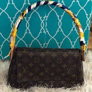 Authentic Louis Vuitton looping on monogram canvas